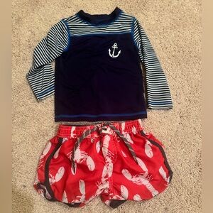 Cat & Jack swim shirt, Carter’s swim shorts, 12 M.